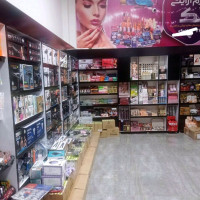 لوگوی فروشگاه لوازم ارایشی تک
